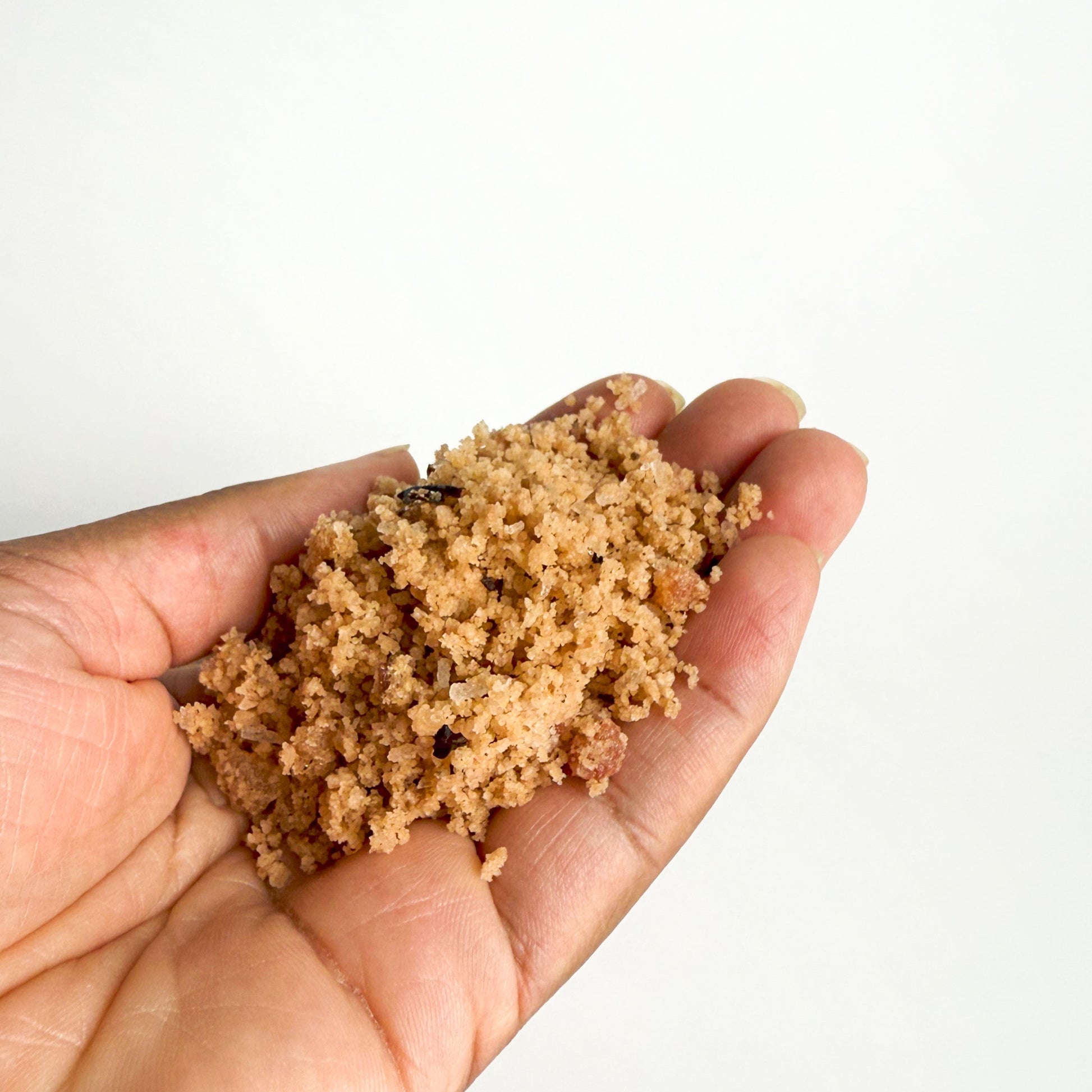 Pink floral bath salt in hand