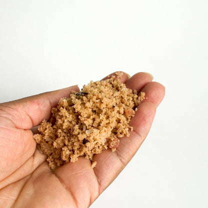 Pink floral bath salt in hand